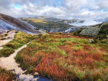 Scenic view of landscape in mountains against sky