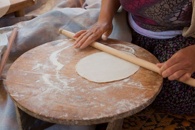 Midsection of woman preparing food