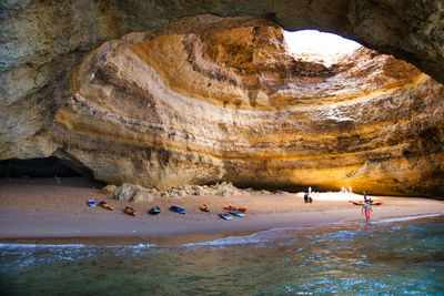 People on rocks at beach