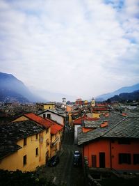 Houses in city against sky