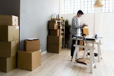 Full length of woman working on floor