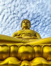 Low angle view of statue against sky