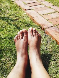 Low section of person legs on grass