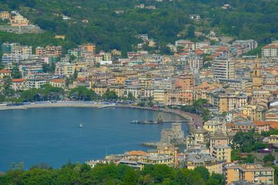 High angle view of townscape by sea