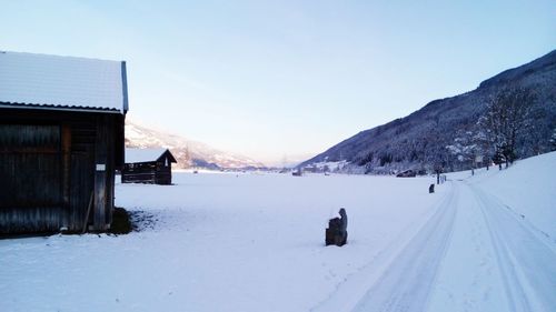 Panoramic view of snow covered landscape against clear sky