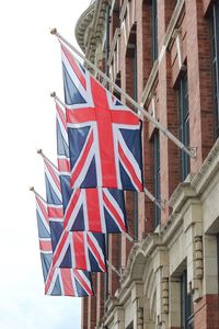 Low angle view of british flags on government building