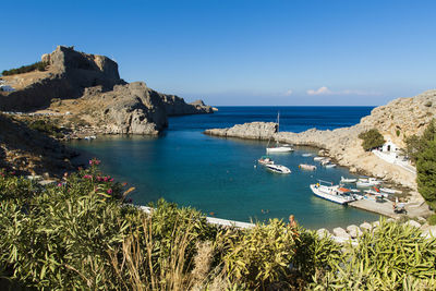 Scenic view of sea against clear blue sky