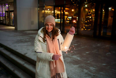 Caucasian white girl with sparklers christmas shopping