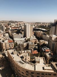 High angle view of buildings in city against clear sky