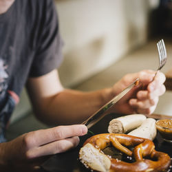 Close-up of man preparing food