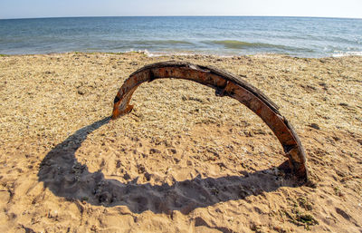 Heart on the beach. installation with colorful colored rust iron and its shade. 