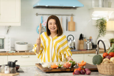 Portrait of smiling young woman at home