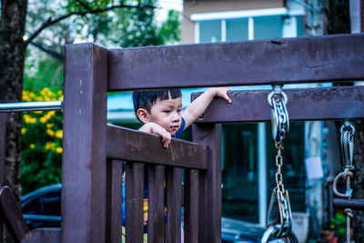 Portrait of a little boy playing in playground. child on playground. activity for kid concept.