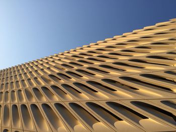 Low angle view of building against clear blue sky