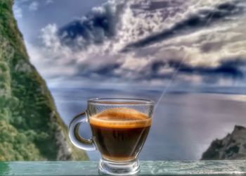 Close-up of coffee on table against sky