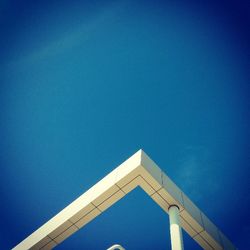 Low angle view of built structure against clear blue sky