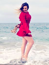 Portrait of beautiful young woman on beach