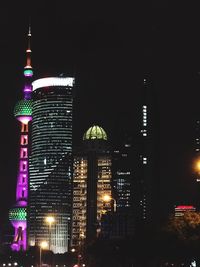 Low angle view of illuminated building at night