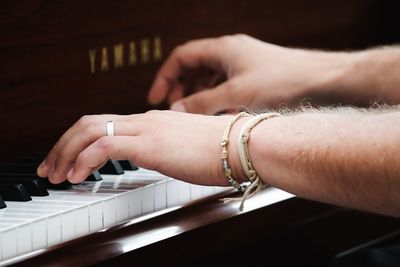 Close-up of woman hand holding piano