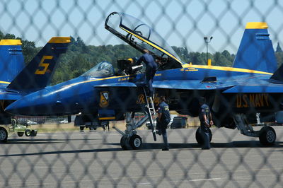 View of airplane at airport runway