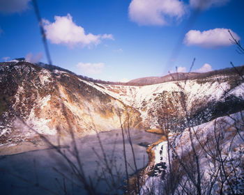 Scenic view of mountains against sky during winter