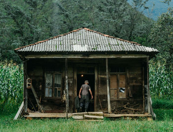 Full length of man outside house