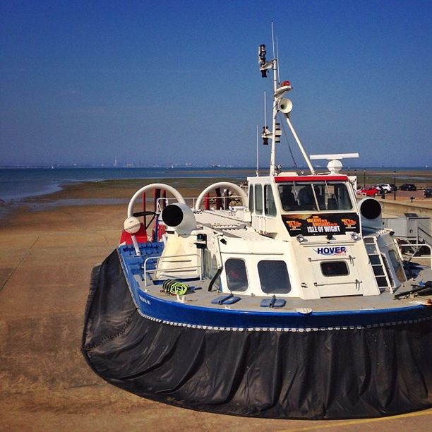 nautical vessel, clear sky, transportation, mode of transport, boat, sea, water, blue, moored, beach, copy space, sand, shore, travel, day, outdoors, harbor, nature, sunlight, incidental people