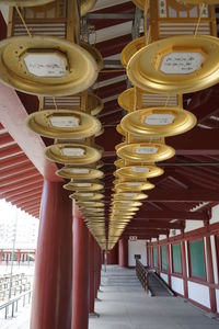 Illuminated lanterns hanging in building