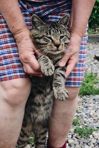 Midsection of person holding hands