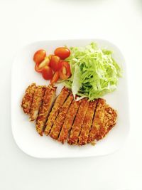 High angle view of meal served in plate over white background