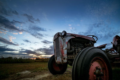 Tractor on field against sky