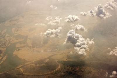 Aerial cloudscape showing interesting clouds in golden light.