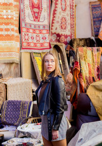 Woman standing at market stall