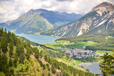 Scenic view of lake and mountains against sky