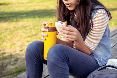 Young woman using mobile phone