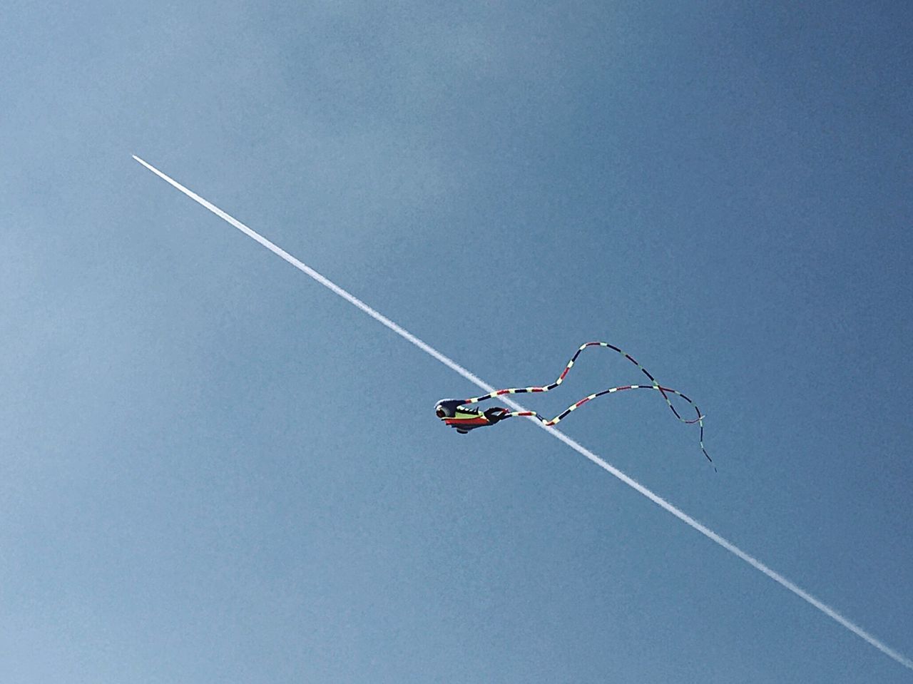 LOW ANGLE VIEW OF AIRPLANE AGAINST CLEAR SKY