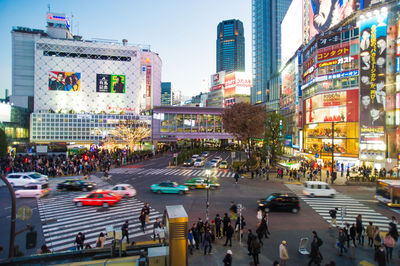 People walking on road in city