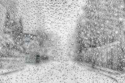 Full frame shot of raindrops on window