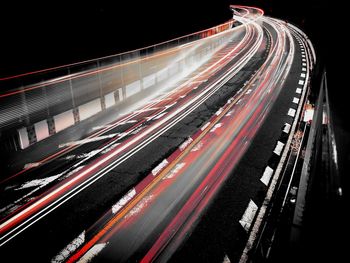 High angle view of light trails on highway at night