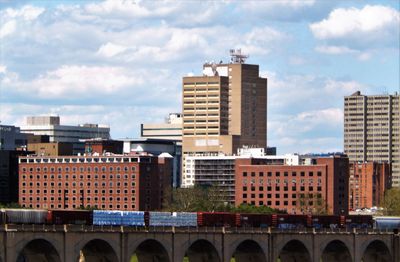 View of buildings against cloudy sky