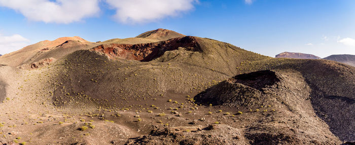 Scenic view of volcano mountains against sky