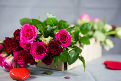 Close-up of pink roses on table