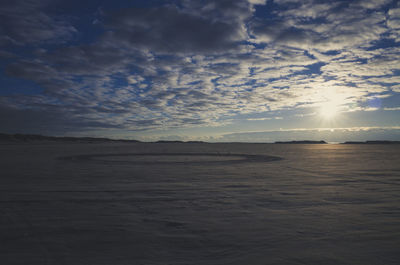 Scenic view of sea against sky at sunset