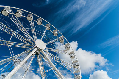 Low angle view of ferris wheel against sky