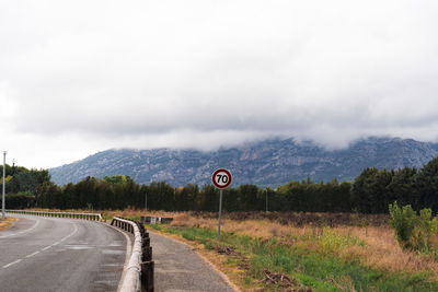 Road sign mountains