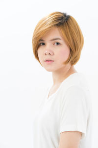 Portrait of a beautiful young woman over white background