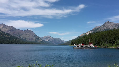 Scenic view of sea and mountains against sky