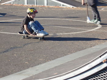 Man skateboarding on street