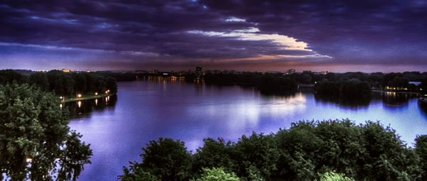 Scenic view of lake against cloudy sky