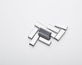 High angle view of straight pin on white background